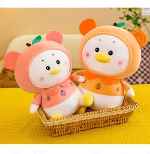 Pair of cute fruit-themed plush ducks in a decorative wicker basket on yellow fabric