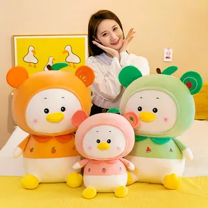 Detail of colorful fruit-themed duck plush toys in orange, pink, and green varieties