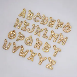 Detailed view of 15mm golden rhinestone A-Z alphabet charms for DIY jewelry making