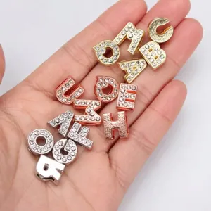 Detailed view of 8mm rhinestone alloy letter beads in gold, silver, and rose gold