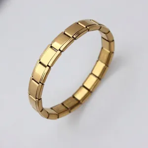 Detailed close-up showing gold-plated modular links of an Italian charm bracelet
