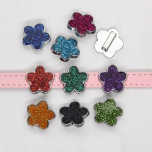 Close-up of 8mm colorful glitter flower slide charms for DIY leather strap bracelets