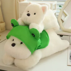 Close-up detail of a cute white plush dog toy wearing a green frog hat with soft fur texture.
