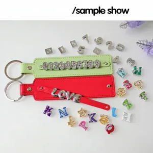 Detailed view of DIY faux leather keychains with 8mm rhinestone slide charms and alphabets
