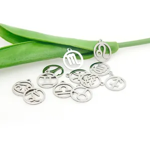 Macro view showing stainless steel zodiac constellation pendants with polished mirror finish