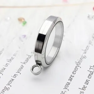 Detailed side view of a 30mm round polished stainless steel floating glass locket