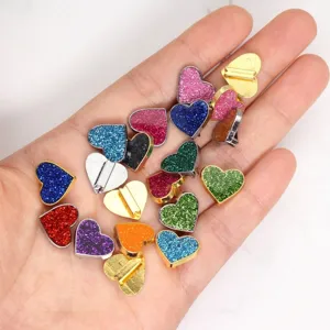 Detailed close-up of 8mm colorful glitter heart charms for DIY jewelry crafts