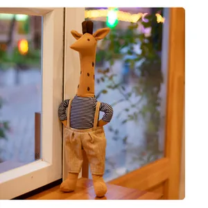 Detailed view of the fabric texture and design of the long-necked giraffe plush toy.
