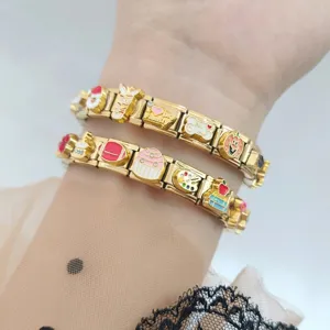 Gold Italian charm modular bracelet featuring colorful enamel cupcake and heart charms