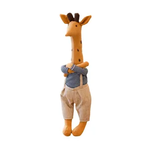 Cute giraffe plush toy in striped shirt and tan overalls for baby nursery decor