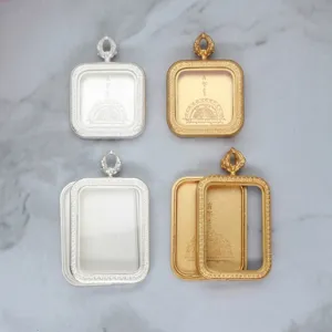Detail of stainless steel Thangka Gau box amulet pendant frames in gold and silver