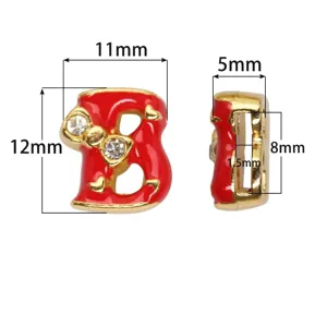 Red enamel letter B bead with rhinestone bow charm detail for DIY jewelry projects