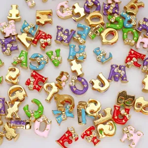 Macro view of 8mm colorful alloy alphabet beads with bow rhinestone for DIY jewelry