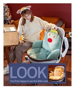Cozy green cartoon electric heated chair cushion shown in a home office setting.