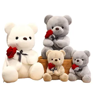 Plush teddy bears holding red roses in multiple colors and sizes for Valentine's Day gifts