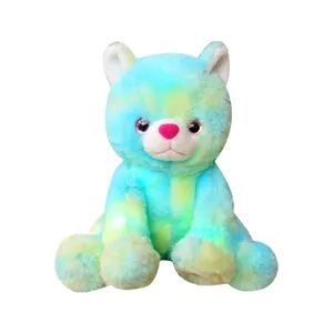 Cute colorful tie-dye glowing cat plush toy sitting isolated on white background