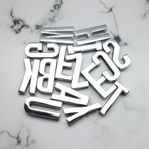 Detailed view of 30mm silver chrome 3D alphabet letters for DIY jewelry and crafts.