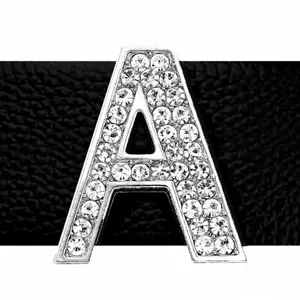 Close-up macro detail of a 30mm silver rhinestone alphabet letter A jewelry charm