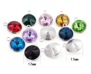Macro view of 17mm birthstone pendants showing faceted stones and metal backings
