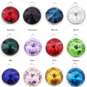 Twelve colorful crystal birthstone pendant charms in silver bezel for DIY jewelry making