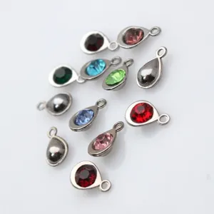 Close-up of colorful alloy teardrop birthstone pendants for DIY jewelry making