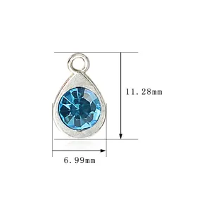 Macro view of silver teardrop birthstone pendant showing size 11.28mm by 6.99mm long.