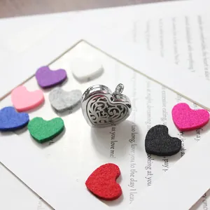 Close-up of 30mm stainless steel heart aromatherapy locket with colorful felt pads