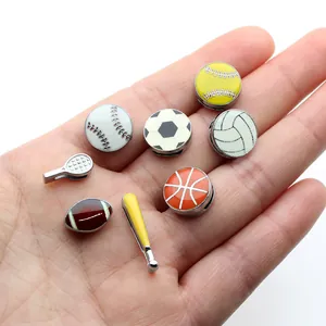 Detailed view of various sport-themed 8mm alloy slide charms displayed on a palm