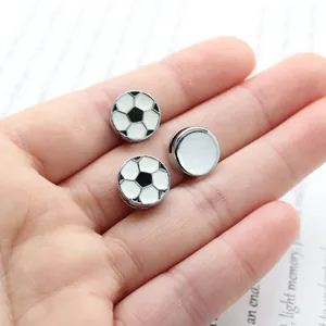 Macro view of detailed enamel soccer ball slide beads for 8mm DIY charm bracelets