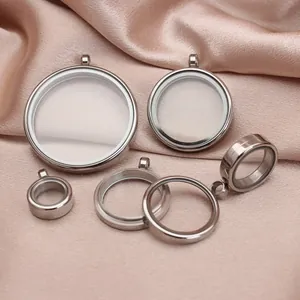 Macro detail view of stainless steel double-sided glass locket pendants in various sizes