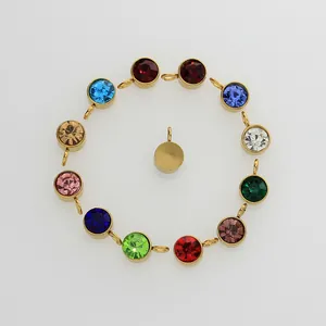 Macro detail of 6mm gold birthstone pendants for DIY jewelry making in 12 colors