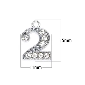 Close-up detail showing the 15mm height and 11mm width of this silver rhinestone number 2 charm