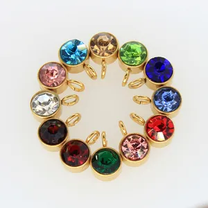 Detailed view of 12 birthstone crystal charms with gold plated stainless steel bezels
