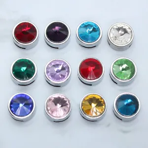 Close-up of 12 colorful 8mm round birthstone crystal beads for jewelry DIY
