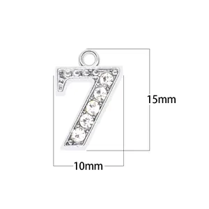 Detailed macro view of rhinestone number 7 pendant showing 15mm by 10mm size specifications.