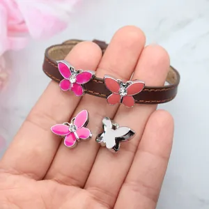Macro detail of alloy butterfly slide charms for 8mm DIY leather bracelet accessories
