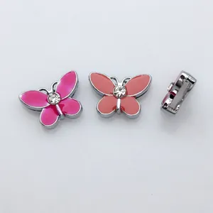 Detailed view of colorful enamel butterfly slide charms with sparkling rhinestone centers