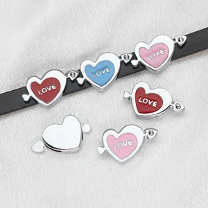 Close-up of 8mm heart-shaped slide charms with 'LOVE' text and tiny rhinestone accents.