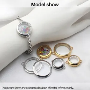 Stainless steel round glass floating locket bracelet worn by model with charms