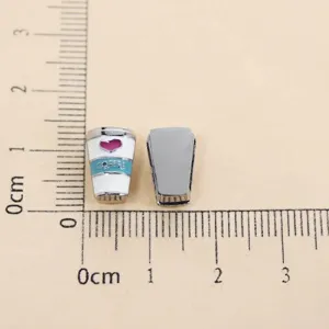 Detailed view of 8mm coffee cup slide charm with heart pattern for DIY wristband accessories