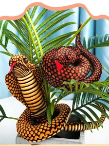 Detail view of lifelike cobra and python plush toys coiled around green potted plants.