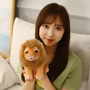 Close-up of a cute lion plush toy held by a model in a warm home lighting setting