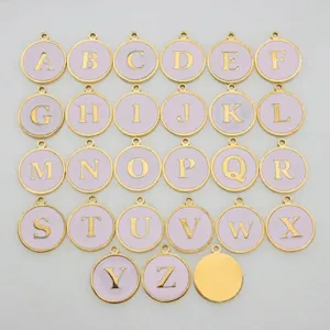 Detailed close-up view of light purple round alphabet charms with gold lettering.