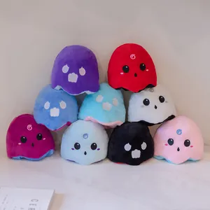 Group of colorful reversible ghost plush toys with various facial expressions for Halloween