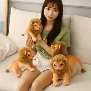 Set of cute lion plush toys being held by an Asian model in a cozy indoor home setting.