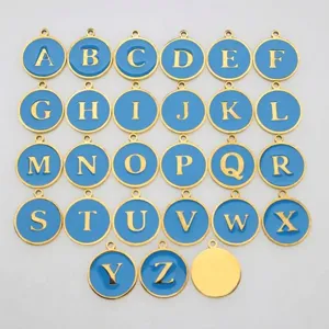 Detailed view showing a set of 26 blue enamel round alphabet charms with gold borders