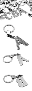 Detailed close-up of 35mm silver alloy alphabet keychains with luxury rhinestone inlay