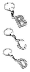 Detailed view of silver alloy keychains with rhinestones in letters B, C, and D