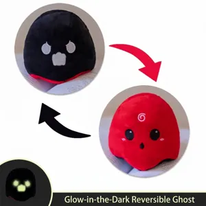 Close-up of reversible nocturnal ghost plush toy showing dual colors and glow effect