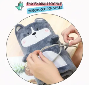 Detail showing the gray plush husky blanket being rolled and secured with a strap